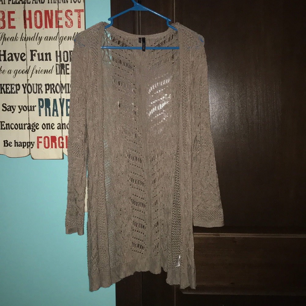 Maurice’s brown cardigan